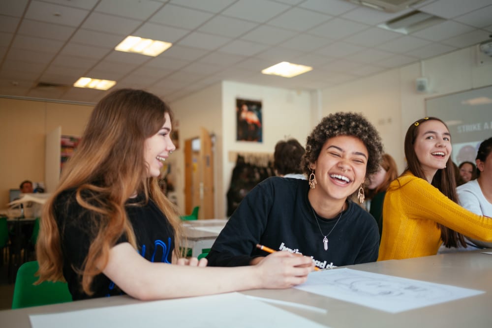 3 laughing Future Creatives students