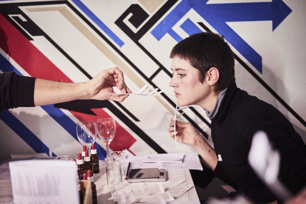 Woman smelling perfume