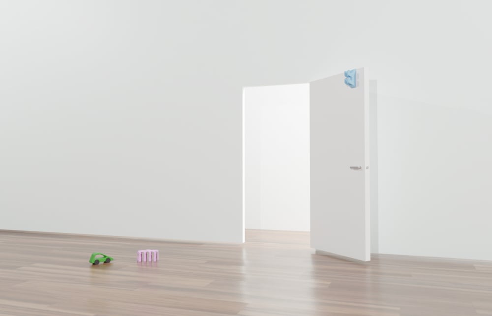 Room with white walls and Conor's toys