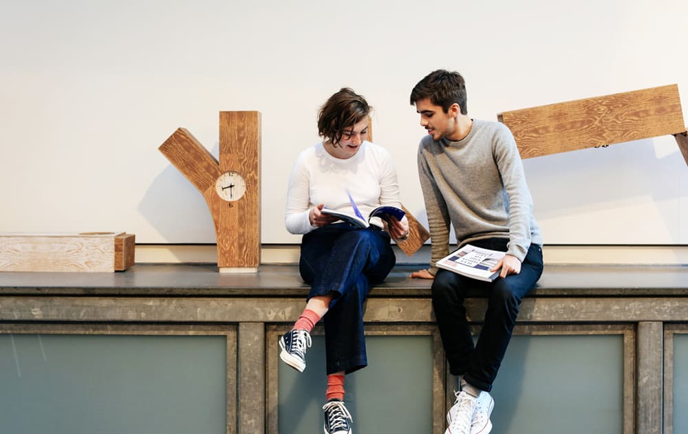 students sitting on workbench