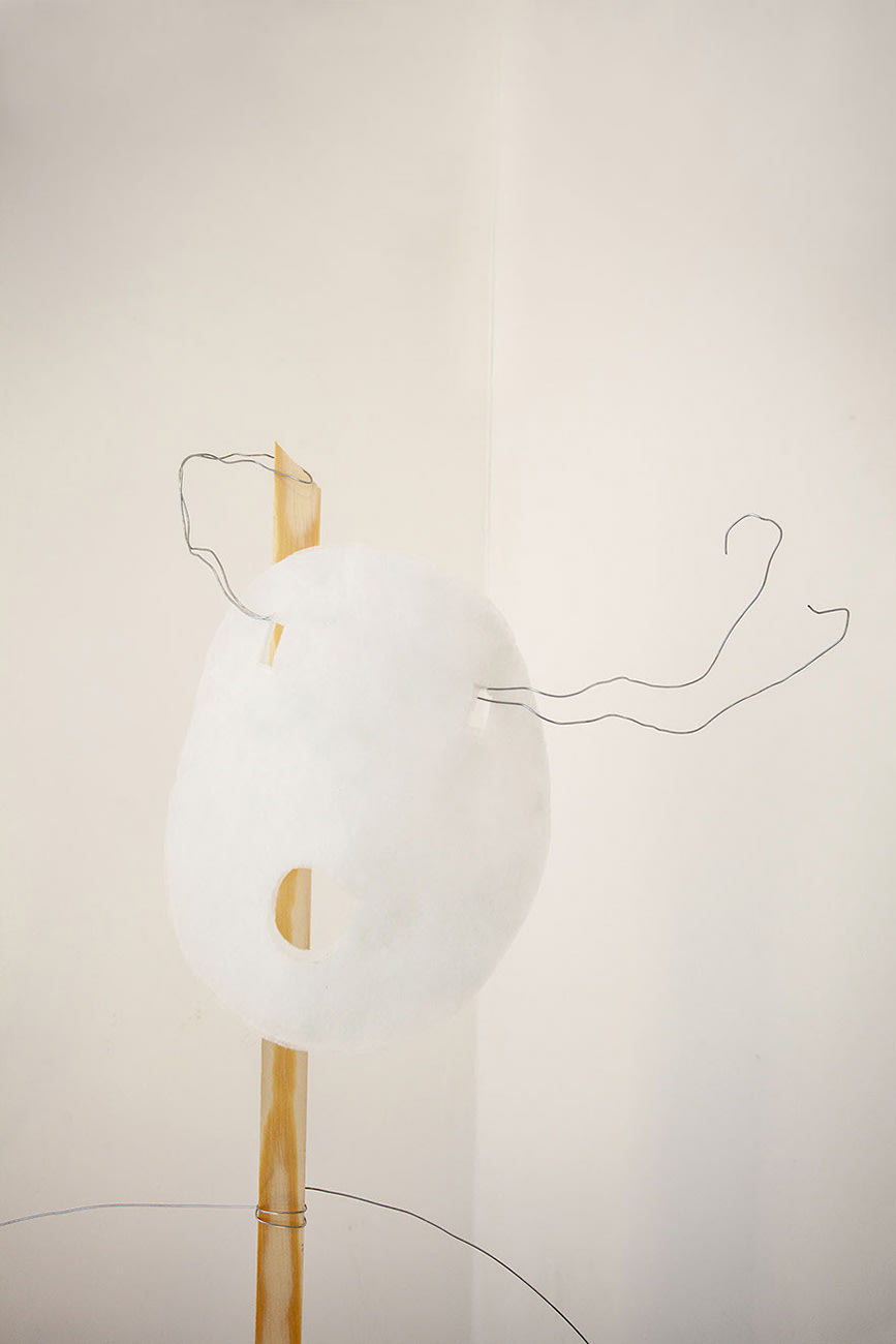 A sculpture made from wire and wood.