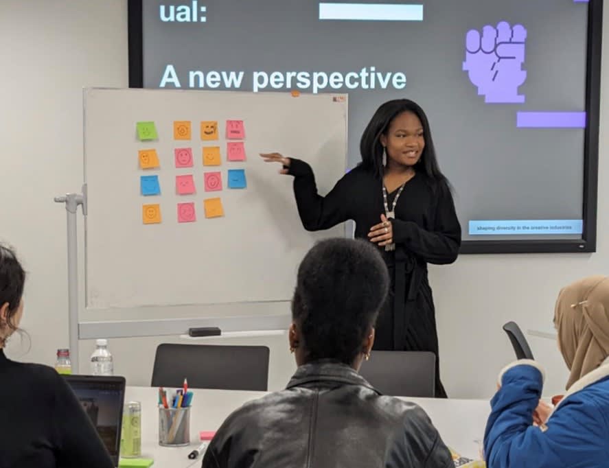 Image of Tireni in front of a whiteboard