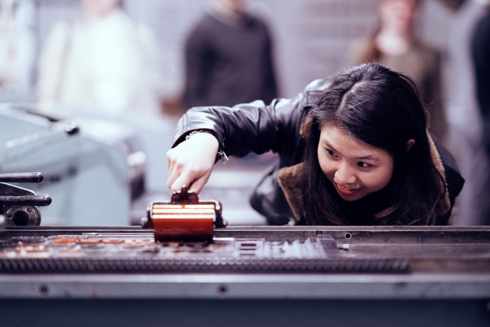 Woman using the letterpress