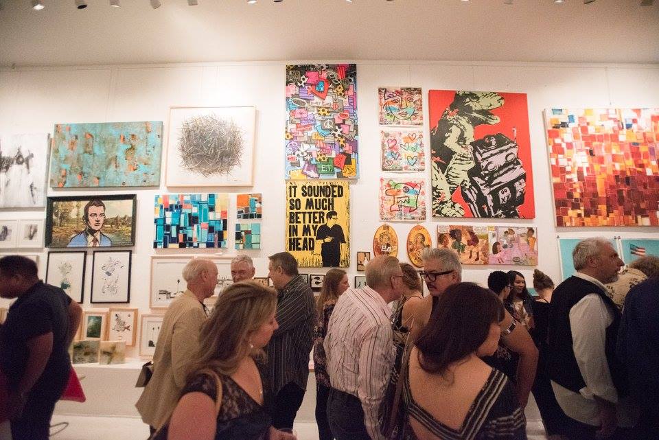 Guests in front of a colourful exhibition