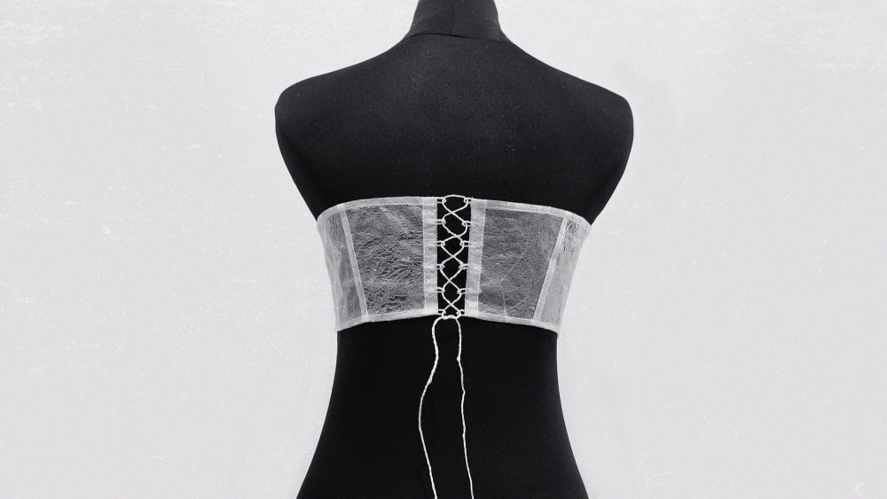 Back view of mannequin with delicate lace up garmen