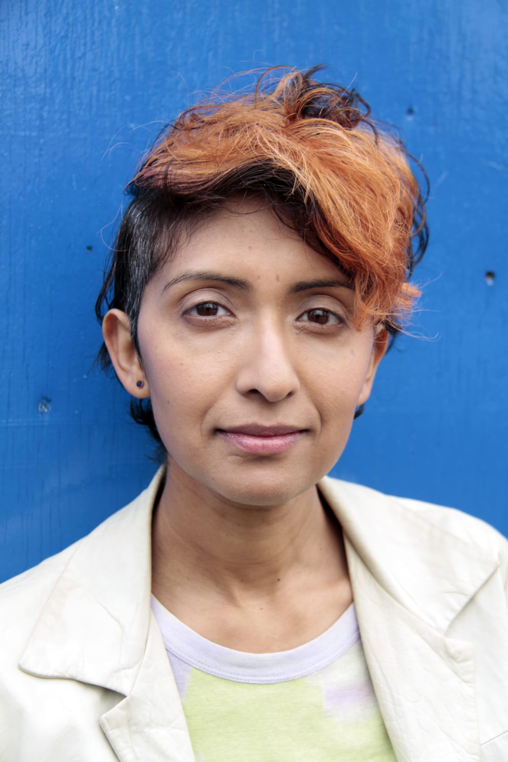 Michelle Williams Gamaker shot against a blue background 