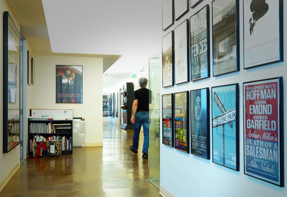 A photograph of an office filled with posters.