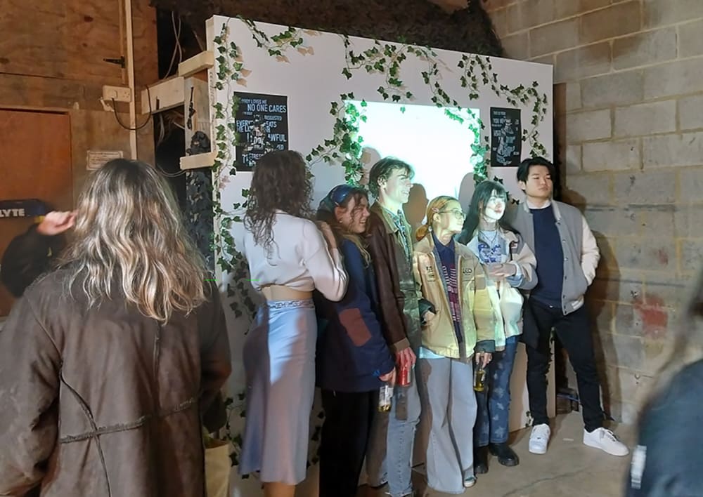 Students interact with exhibited work.