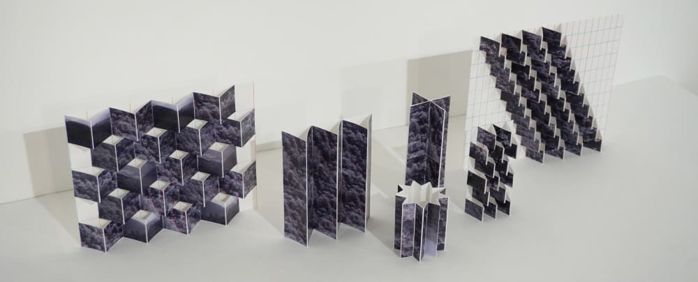 variations on eleni's final project, lots of different paper models made to look like abstract versions of a mountain