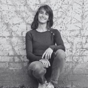 Image of Natasha Freedman sat against a white wall