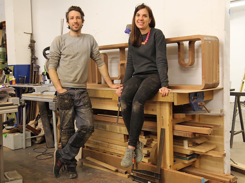 2 people stood in their workshop