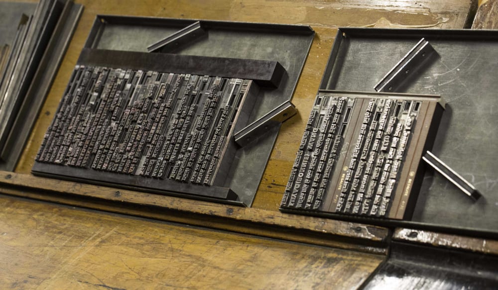 People using the letterpress at Central Saint Martins