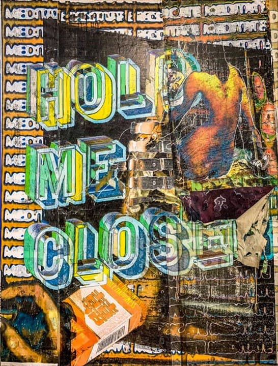 Graphic painting with the words 'Hold me closer' on it