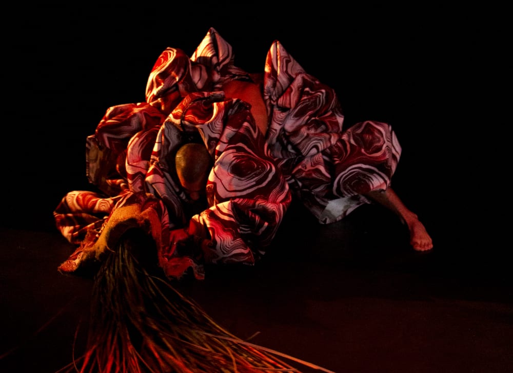 Model in large red costume