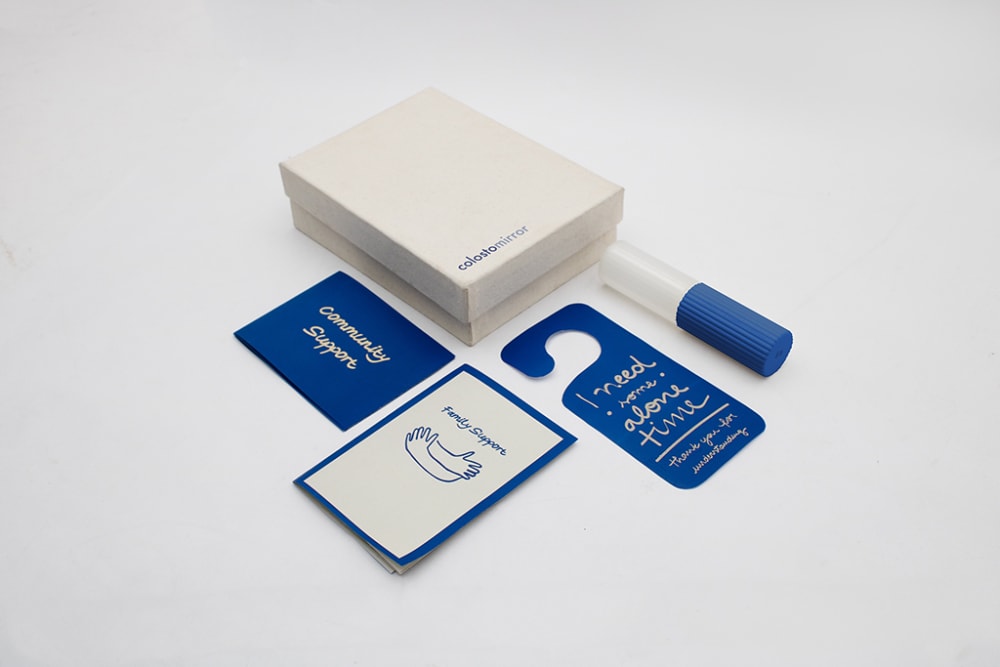 A white and blue kit with care instructions and other resources.