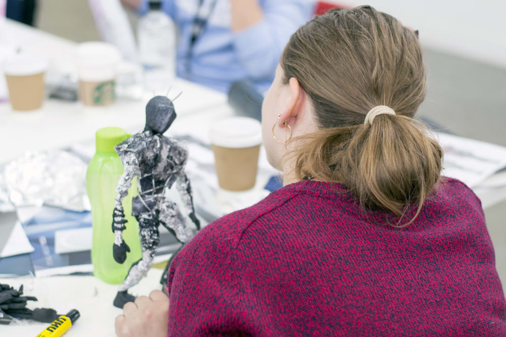 Student working on a scale model