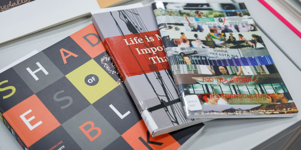 Pamphlets and booklets on a table.