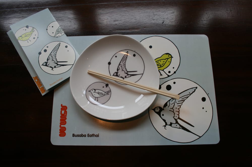 Dinner service laid out on table with 