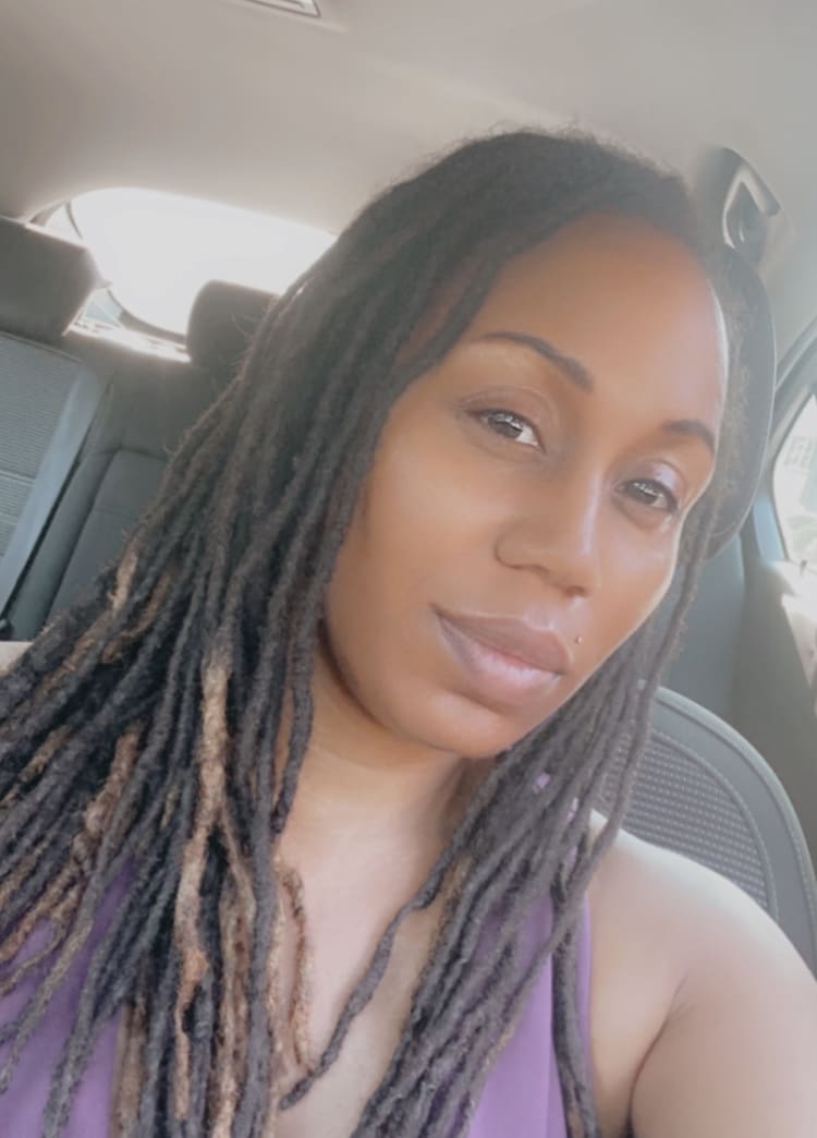 Photo of a woman looking into the camera