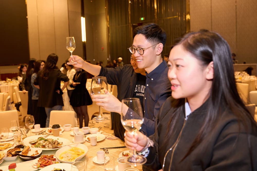 Alumni raising their glasses