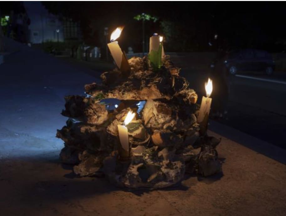 sculpture lit up at night