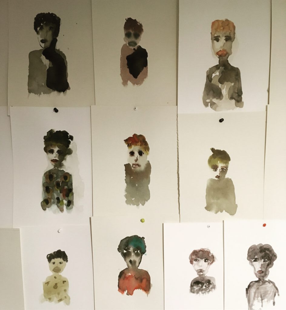 Photo of abstract paintings of people