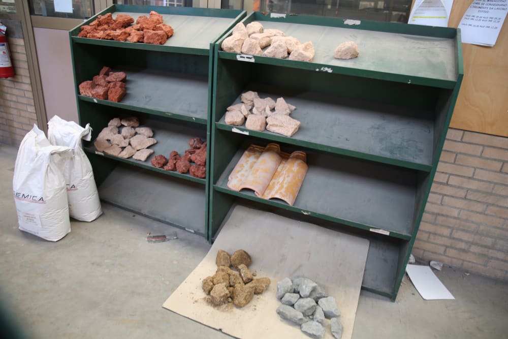 different types of clay displayed on shelves