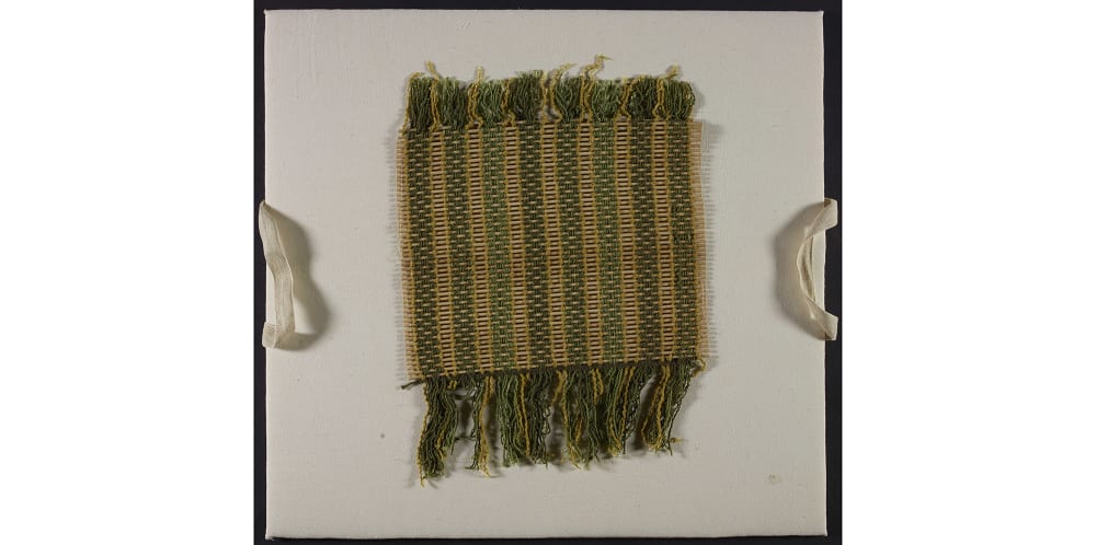 Woven placemat mounted on fabric