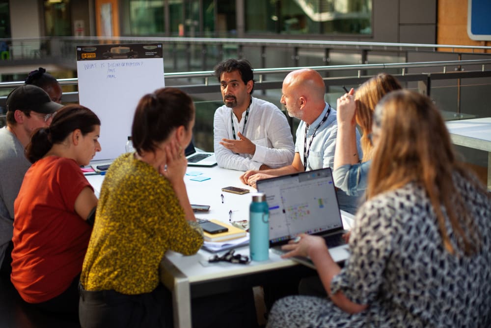 Fellows discussing disinformation in breakout groups