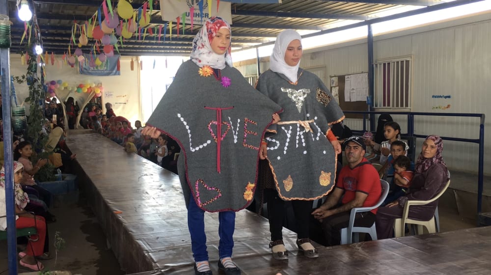 Two girls from Zaatari camp at the first community catwalk