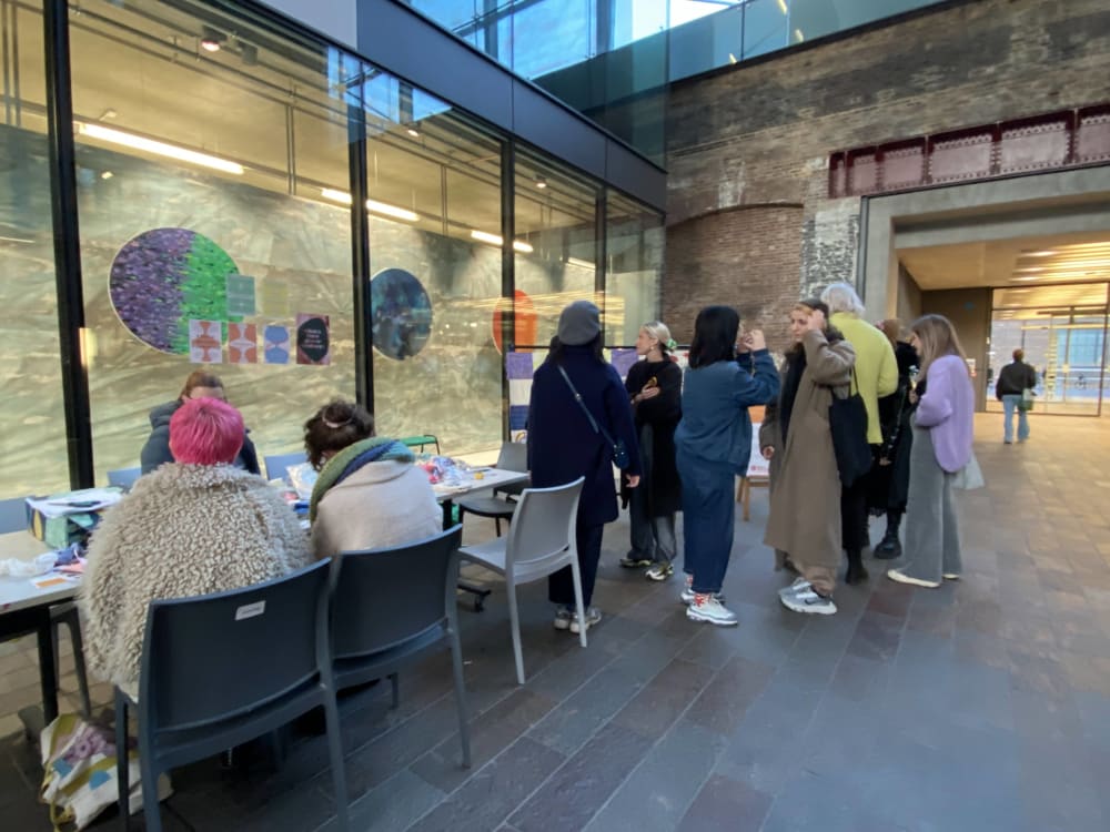 people working on a tapestry workshop