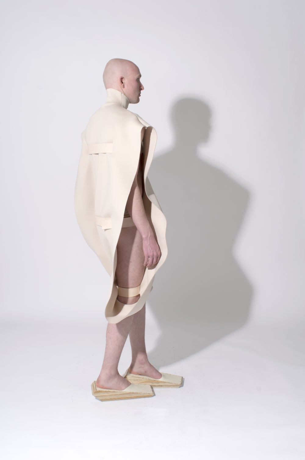 Dirk wearing his wooden footwear creations