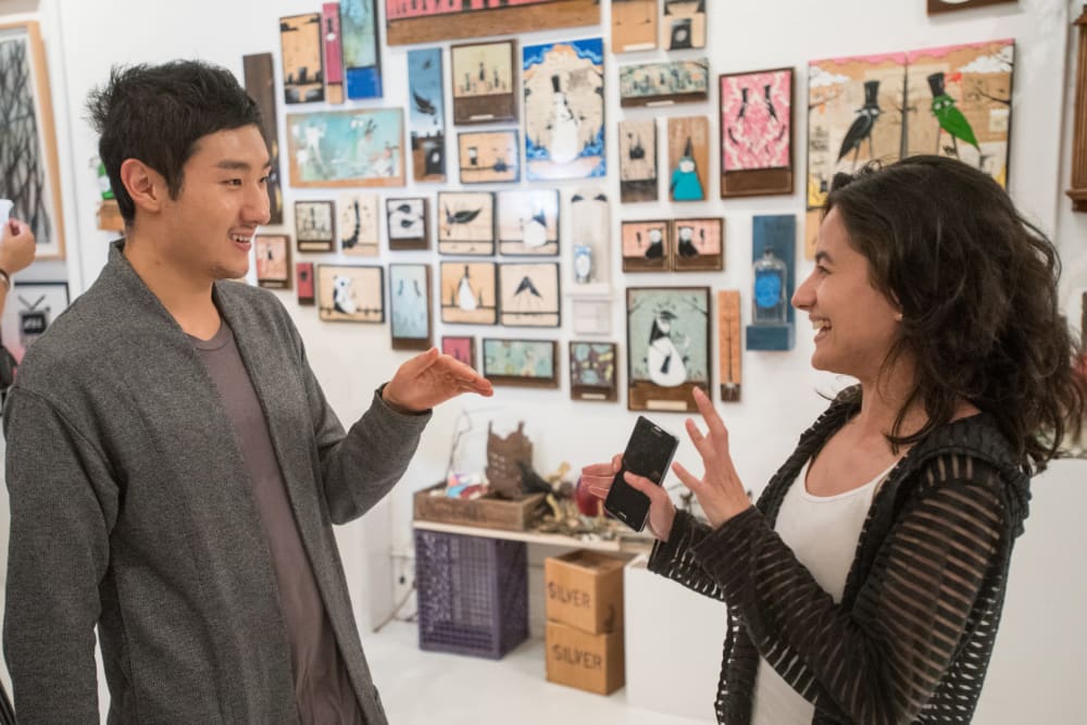 Photo of two people chatting