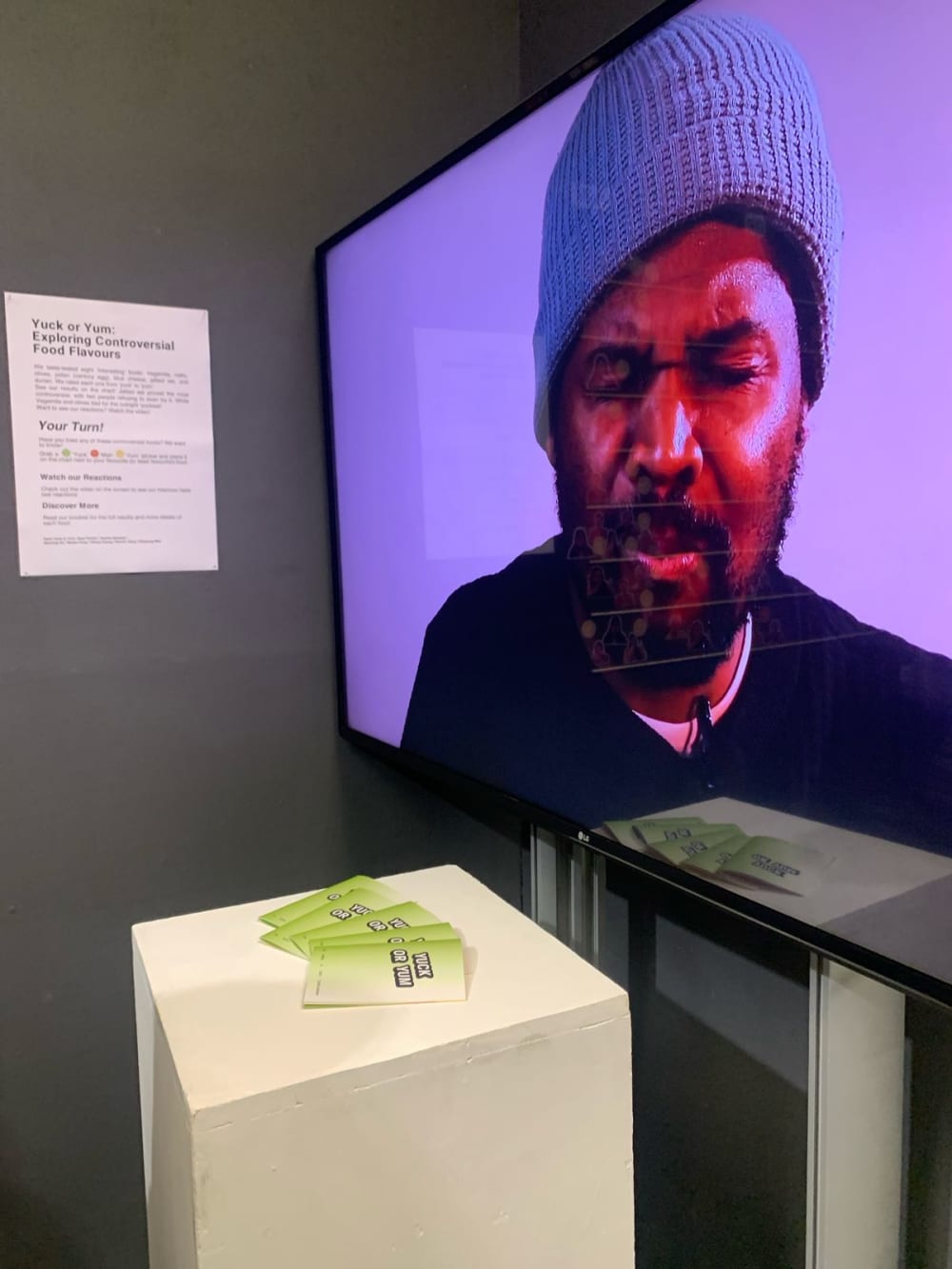 a person grimacing on a tv screen