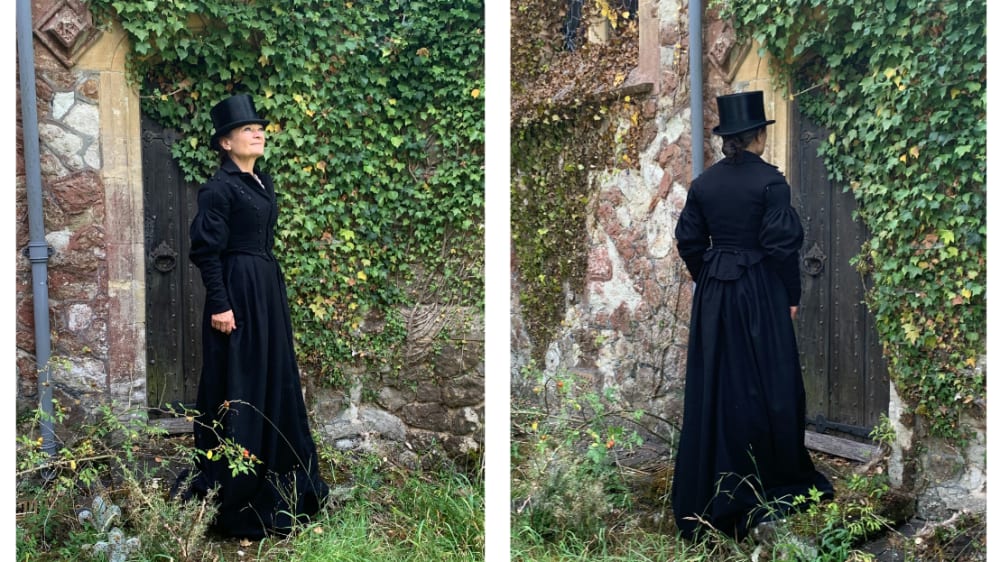 Two images of woman in black coat and top hat in a green, leafy garden.