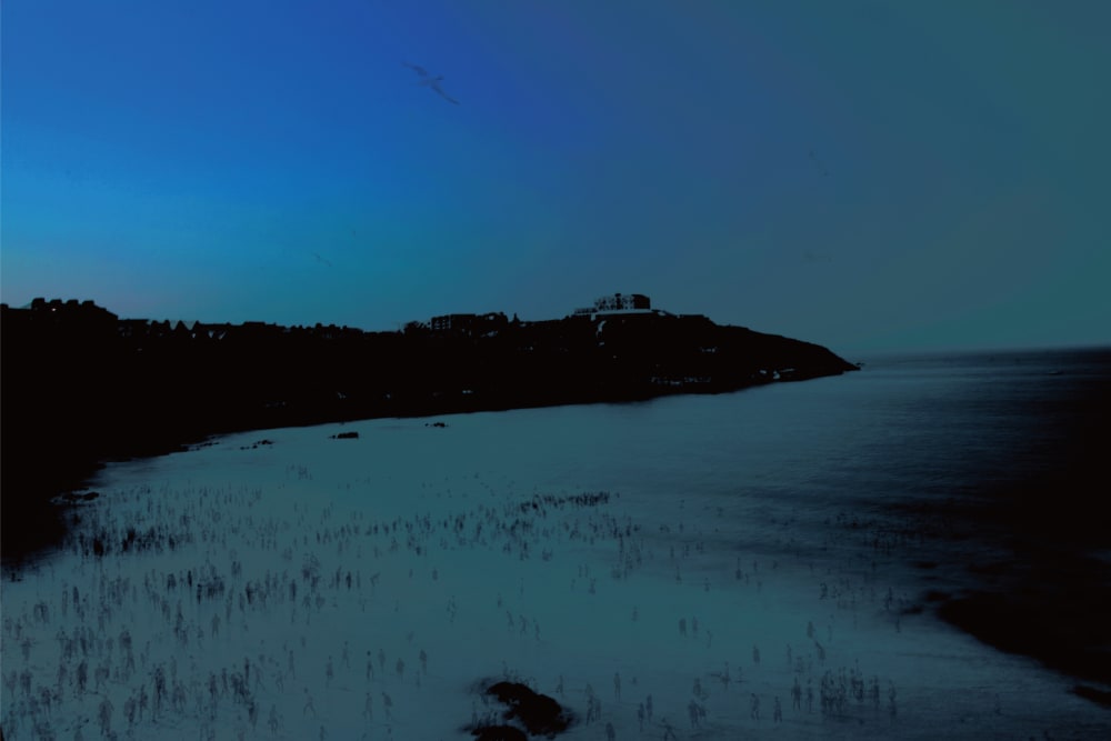 A photo of a beach at night