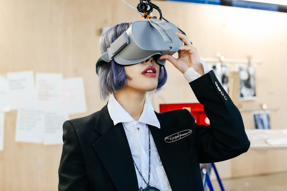 Student tests out a virtual reality set.