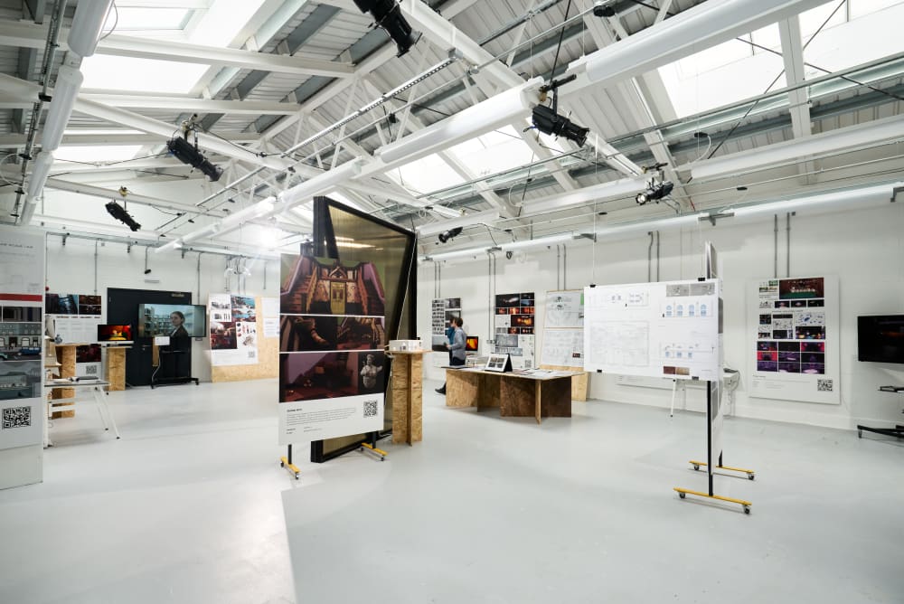 A studio at Wimbledon, full of student work displayed along the side.