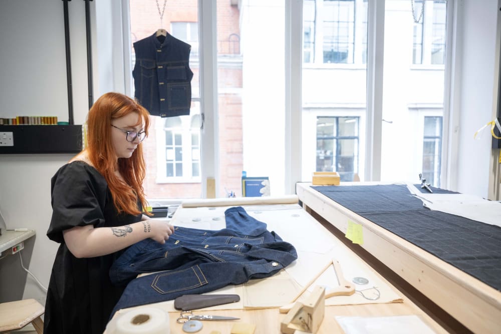 Someone measuring a garment.