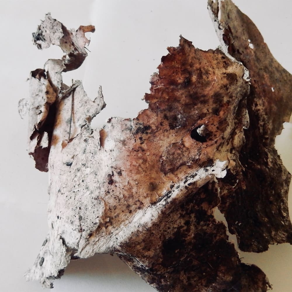 3D sculptural piece, textured, white, yellow, and brown colours.