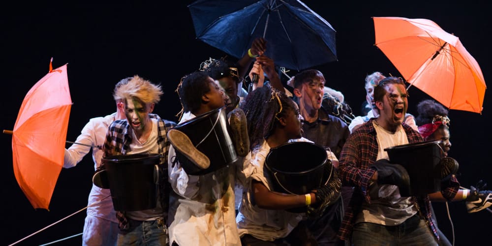 A group of students performing on stage at UAL Awarding Body's Emerge festival.