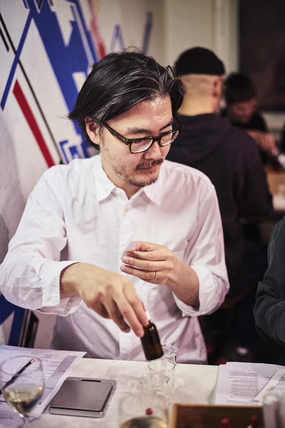 A guest creating his own perfume