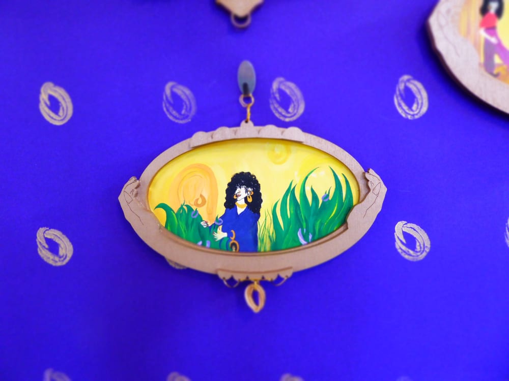 Illustration of figure on yellow background, inside a wooden frame featuring hands.