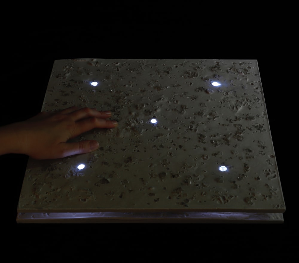 Riina Oun's Pavement powered by piezoelectricity lit up in the dark