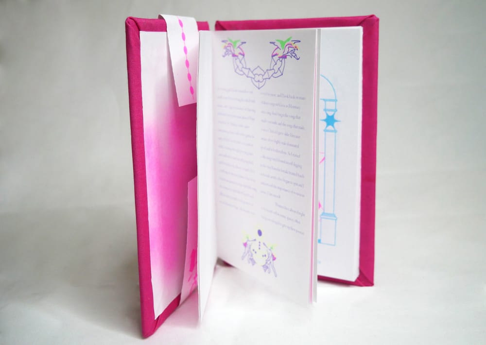 The book is partially opened to provide a preview of the contents. 