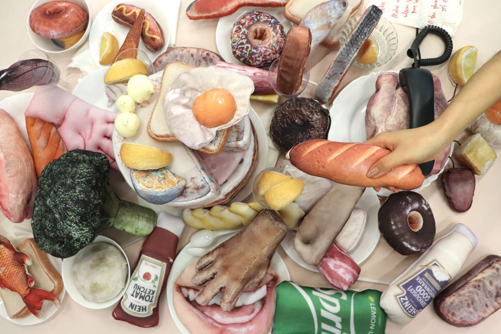 Table laid with food that's made from textiles