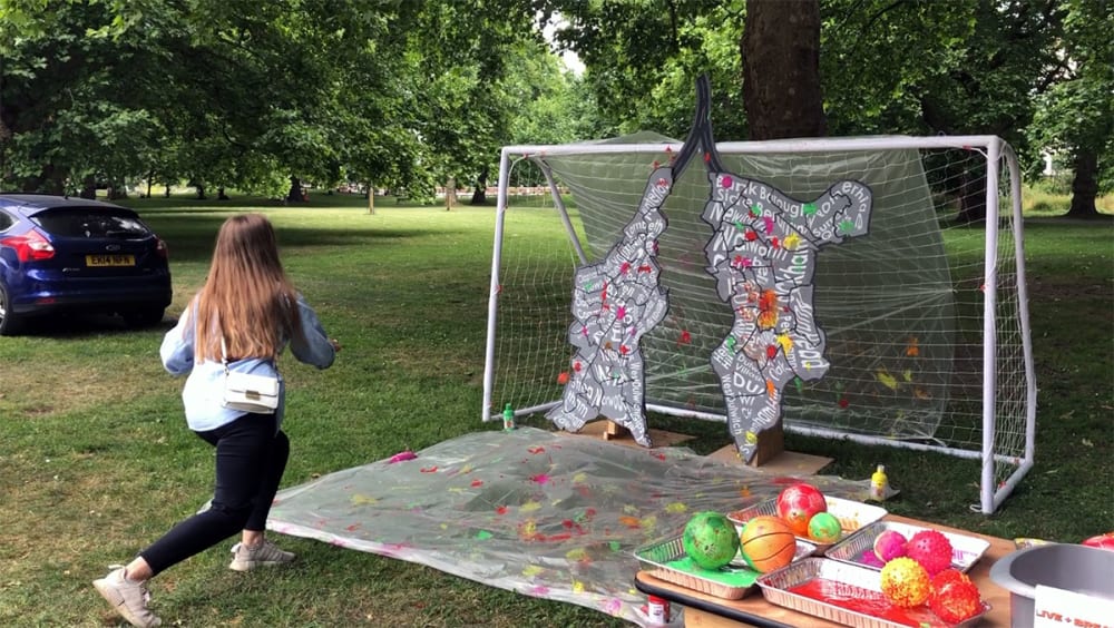 A girl takes part in the lungs activity.
