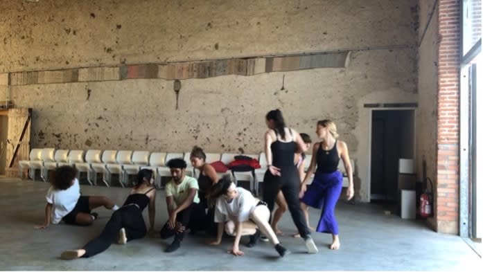 people kneeling and standing in a room