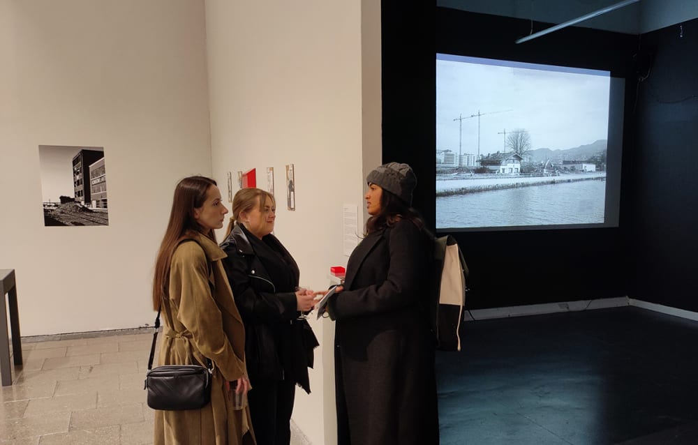 Photograph of visitors in an exhibition space.