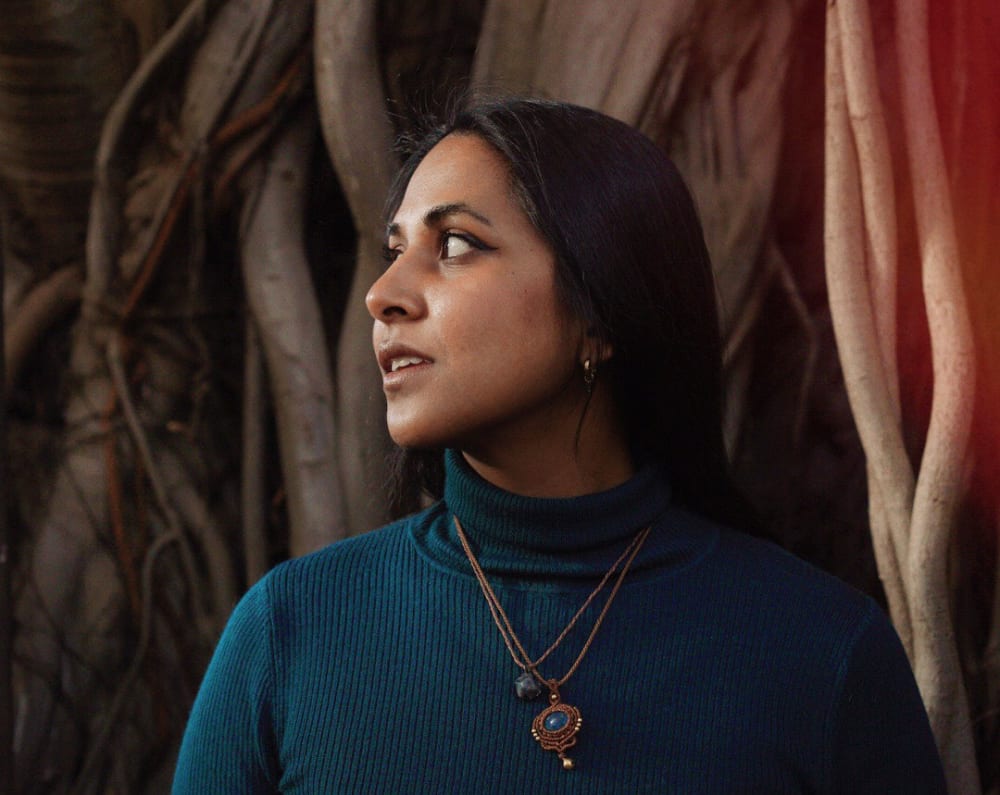 Head shot of Valeria. She's got long, dark hair and is looking to the right. 